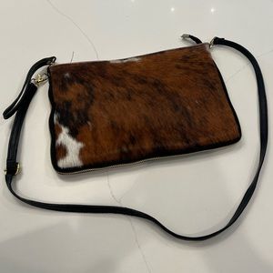 Leather and cowhide cross body purse. Black leather